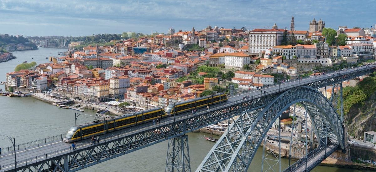 Stunning aerial shot of the iconic Luís I Bridge spanning the Douro River in Porto, Portugal.